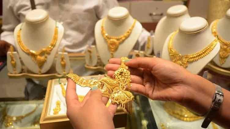 Gold prices fall after record high