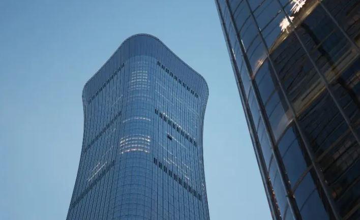 Small aircraft crashes into Beijing's tallest building, eyewitnesses say