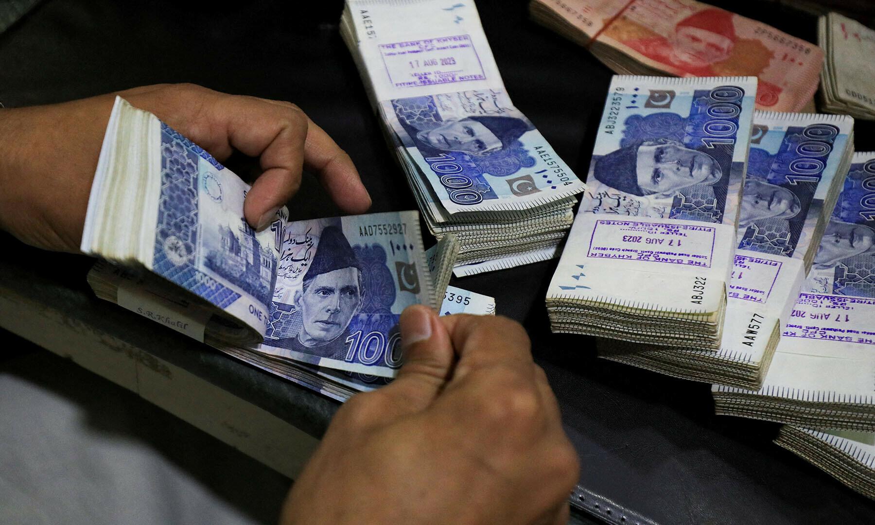 Pakistani rupee slightly weaker against US dollar