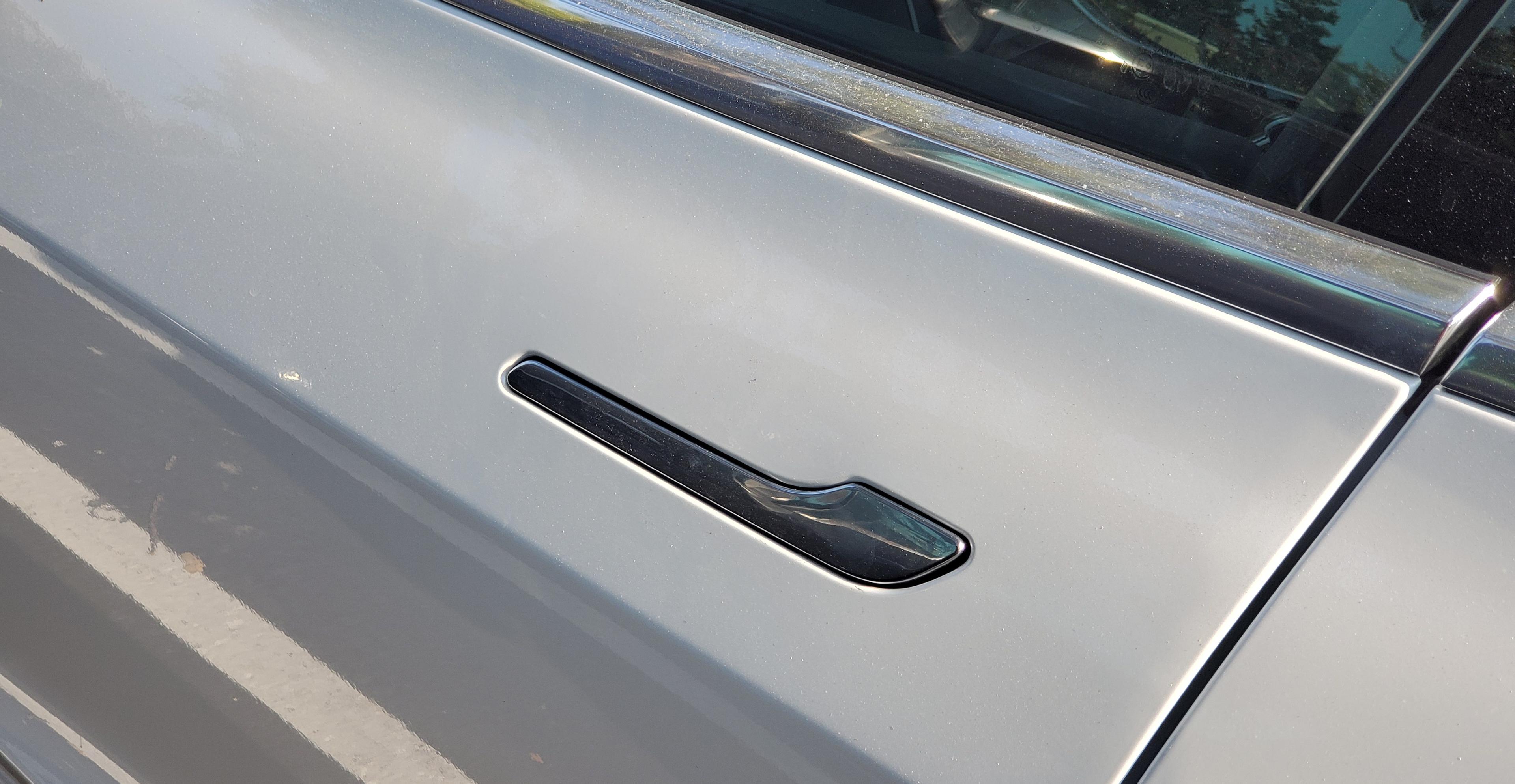 Tesla is updating its passenger-trapping door handles